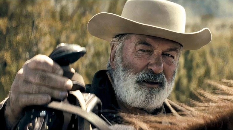 Alec Baldwin as Hardland Rust standing by his horse in Rust
