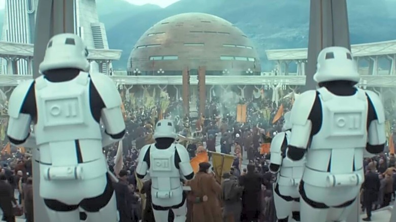 Stormtroopers approaching a crowd of protestors in Andor