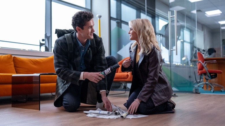 Jonah Hauer-King as Conrad and Millie Gibson as Ruby Sunday crouched on the floor on Doctor Who