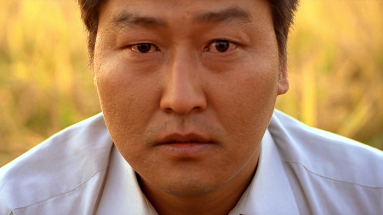 Detective Park stares into the camera, grappling with his conscience in 