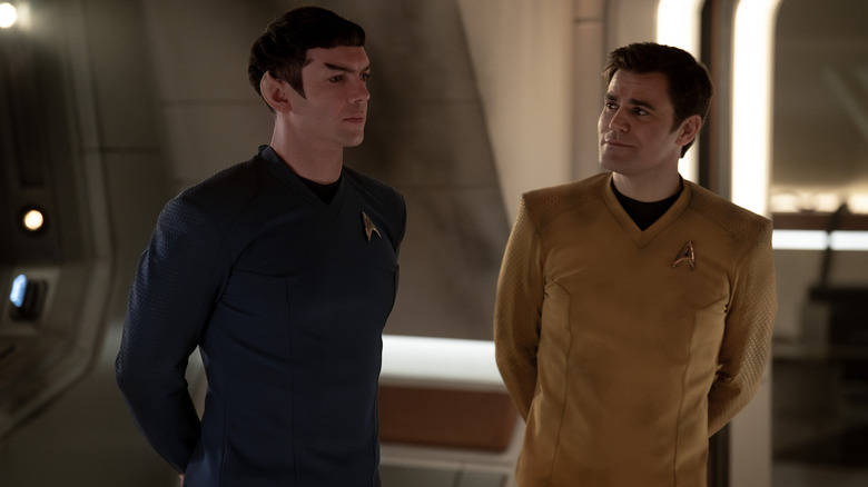 Ethan Peck as Spock standing beside Paul Wesley as Kirk in Star Trek: Strange New Worlds season 3